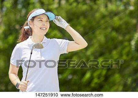 Japanese woman practicing golf in the garden View Large Photo Image Stock Image - Japanese woman practicing golf in the garden. Fotosearch