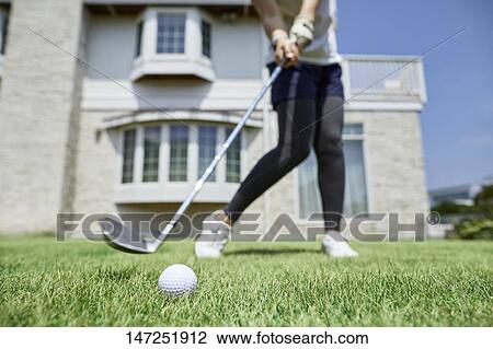 Japanese woman practicing golf in the garden View Large Photo Image Stock Image - Japanese woman practicing golf in the garden. Fotosearch