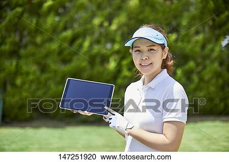 Japanese woman practicing golf in the garden View Large Photo Image Stock Image - Japanese woman practicing golf in the garden. Fotosearch