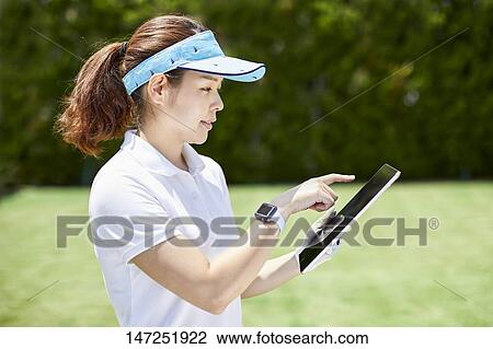 Japanese woman practicing golf in the garden View Large Photo Image Stock Image - Japanese woman practicing golf in the garden. Fotosearch