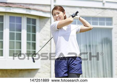 Japanese woman practicing golf in the garden View Large Photo Image Stock Photo - Japanese woman practicing golf in the garden. Fotosearch