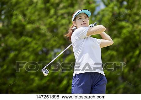 Japanese woman practicing golf in the garden View Large Photo Image Stock Photo - Japanese woman practicing golf in the garden. Fotosearch