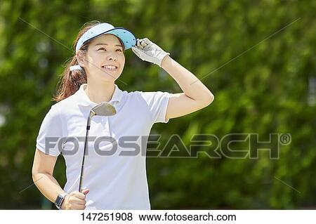 Japanese woman practicing golf in the garden View Large Photo Image Stock Photo - Japanese woman practicing golf in the garden. Fotosearch