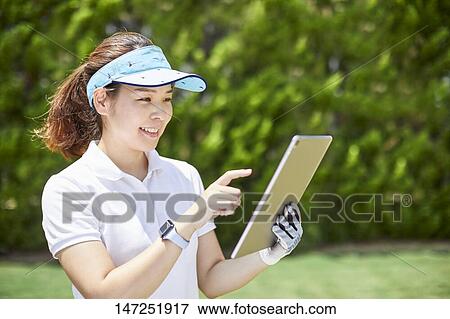 Japanese woman practicing golf in the garden View Large Photo Image Stock Photo - Japanese woman practicing golf in the garden. Fotosearch