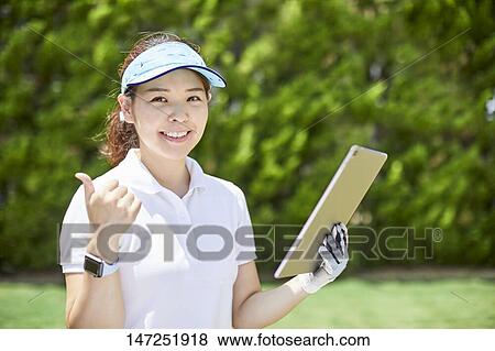 Japanese woman practicing golf in the garden View Large Photo Image Stock Photo - Japanese woman practicing golf in the garden. Fotosearch