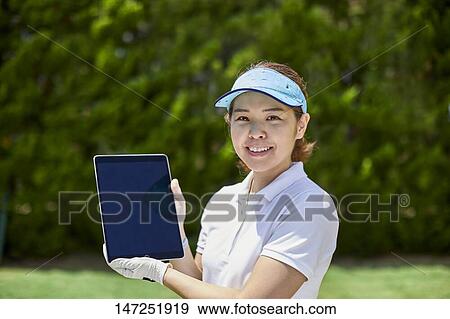 Japanese woman practicing golf in the garden View Large Photo Image Stock Photo - Japanese woman practicing golf in the garden. Fotosearch