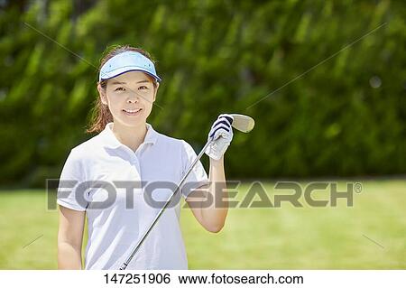 Japanese woman practicing golf in the garden View Large Photo Image Stock Photograph - Japanese woman practicing golf in the garden. Fotosearch
