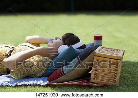Japanese woman relaxing in the garden View Large Photo Image Stock Image - Japanese woman relaxing in the garden. Fotosearch