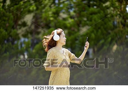 Japanese woman relaxing in the garden View Large Photo Image Stock Photography - Japanese woman relaxing in the garden. Fotosearch