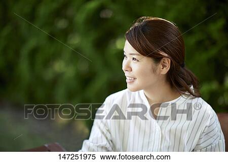 Japanese woman relaxing in the garden View Large Photo Image Stock Photography - Japanese woman relaxing in the garden. Fotosearch