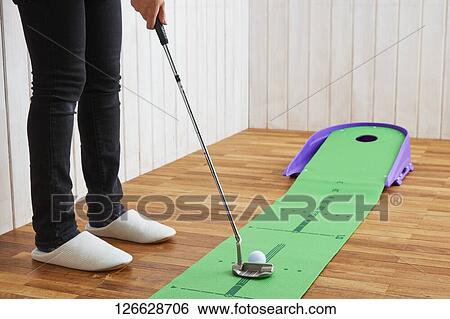 Japanese woman training for golf at home View Large Photo Image Stock Photograph - Japanese woman training for golf at home. Fotosearch