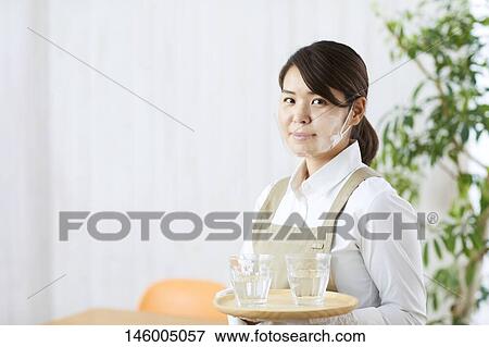 Japanese woman wearing face shield View Large Photo Image Stock Photo - Japanese woman wearing face shield. Fotosearch