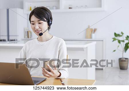 Japanese woman working from home View Large Photo Image Stock Image - Japanese woman working from home. Fotosearch