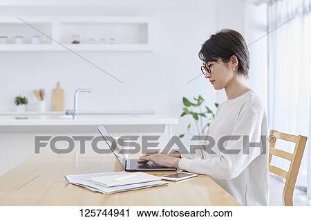Japanese woman working from home View Large Photo Image Stock Image - Japanese woman working from home. Fotosearch