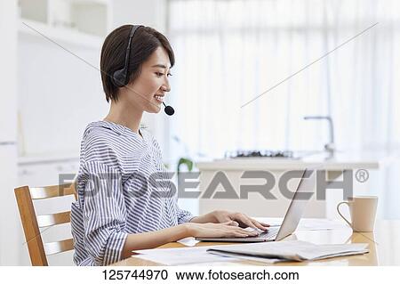 Japanese woman working from home View Large Photo Image Stock Image - Japanese woman working from home. Fotosearch