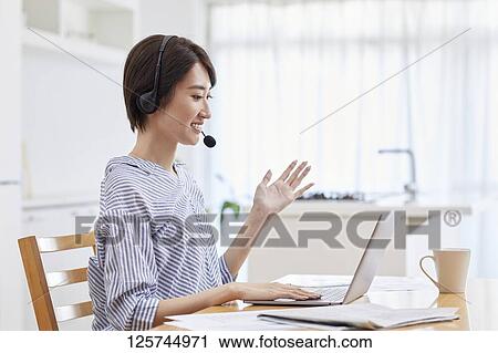 Japanese woman working from home View Large Photo Image Stock Image - Japanese woman working from home. Fotosearch