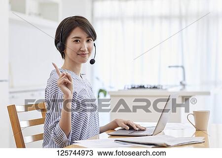 Japanese woman working from home View Large Photo Image Stock Image - Japanese woman working from home. Fotosearch