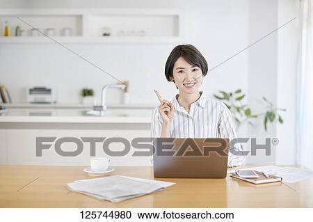 Japanese woman working from home View Large Photo Image Stock Image - Japanese woman working from home. Fotosearch