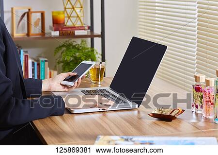 Japanese woman working from home View Large Photo Image Stock Image - Japanese woman working from home. Fotosearch