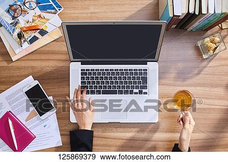 Japanese woman working from home View Large Photo Image Stock Photo - Japanese woman working from home. Fotosearch