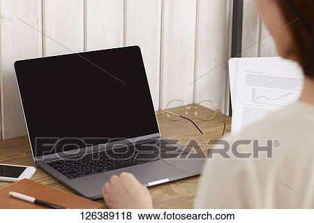 Japanese woman working from home View Large Photo Image Stock Photo - Japanese woman working from home. Fotosearch