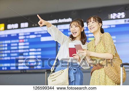 Picture - Japanese women at the airport. Fotosearch