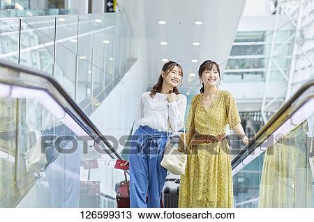 Japanese women at the airport View Large Photo Image Stock Image - Japanese women at the airport. Fotosearch