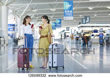 Japanese women at the airport View Large Photo Image Stock Image - Japanese women at the airport. Fotosearch