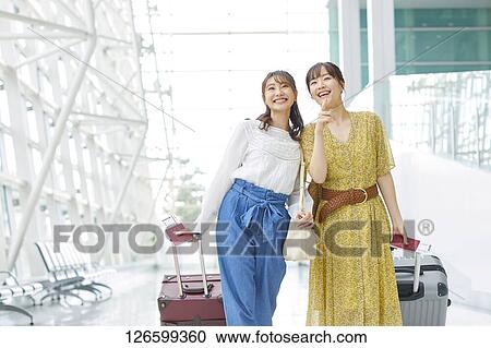 Japanese women at the airport View Large Photo Image Stock Image - Japanese women at the airport. Fotosearch