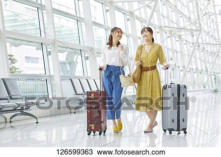 Japanese women at the airport View Large Photo Image Stock Image - Japanese women at the airport. Fotosearch