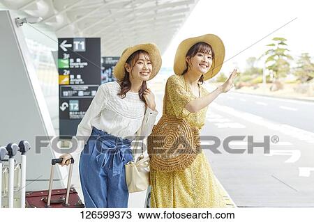 Japanese women at the airport View Large Photo Image Stock Image - Japanese women at the airport. Fotosearch