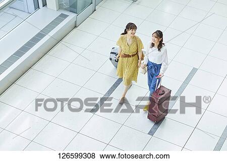 Japanese women at the airport View Large Photo Image Stock Photo - Japanese women at the airport. Fotosearch