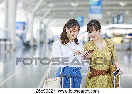Japanese women at the airport View Large Photo Image Stock Photo - Japanese women at the airport. Fotosearch