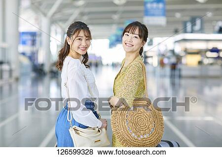Stock Photo - Japanese women at the airport. Fotosearch