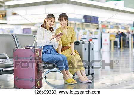 Japanese women at the airport View Large Photo Image Stock Photo - Japanese women at the airport. Fotosearch
