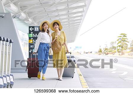 Japanese women at the airport View Large Photo Image Stock Photo - Japanese women at the airport. Fotosearch