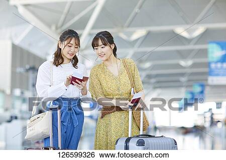 Japanese women at the airport View Large Photo Image Stock Photograph - Japanese women at the airport. Fotosearch
