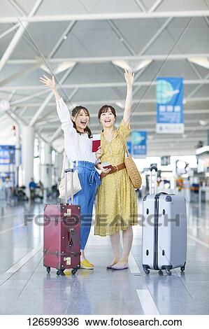 Japanese women at the airport View Large Photo Image Stock Photograph - Japanese women at the airport. Fotosearch