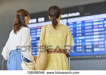 Japanese women at the airport View Large Photo Image Stock Photograph - Japanese women at the airport. Fotosearch