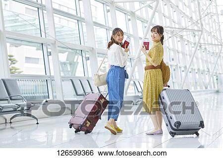 Japanese women at the airport View Large Photo Image Stock Photograph - Japanese women at the airport. Fotosearch