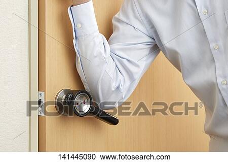 Stock Image - Man Opening The Door. Fotosearch