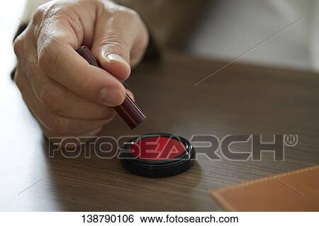Stock Photograph - Man Putting Seal. Fotosearch