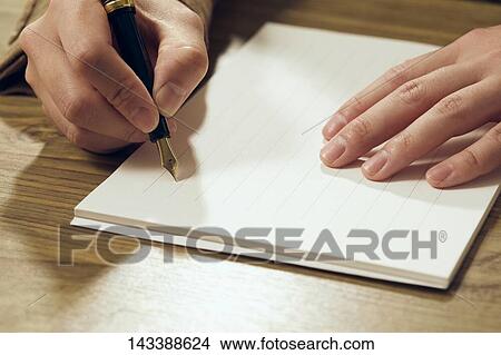 Man writing on paper View Large Photo Image Picture - Man writing on paper. Fotosearch