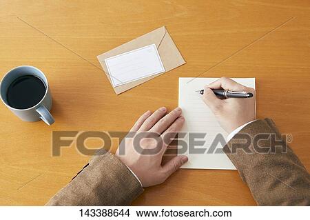Man writing on paper View Large Photo Image Picture - Man writing on paper. Fotosearch