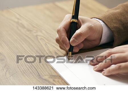 Man writing on paper View Large Photo Image Stock Image - Man writing on paper. Fotosearch