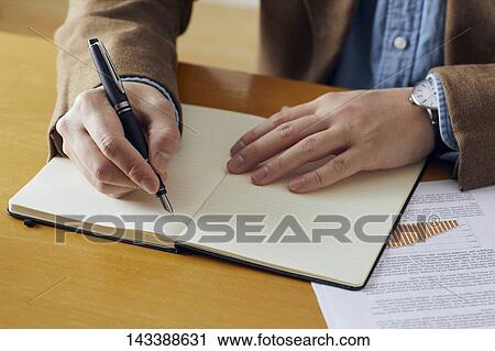Man writing on paper View Large Photo Image Stock Image - Man writing on paper. Fotosearch