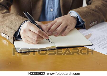 Man writing on paper View Large Photo Image Stock Image - Man writing on paper. Fotosearch