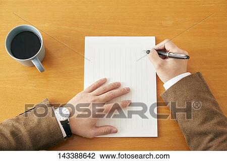 Stock Image - Man writing on paper. Fotosearch