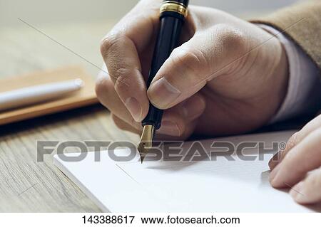 Man writing on paper View Large Photo Image Stock Photo - Man writing on paper. Fotosearch