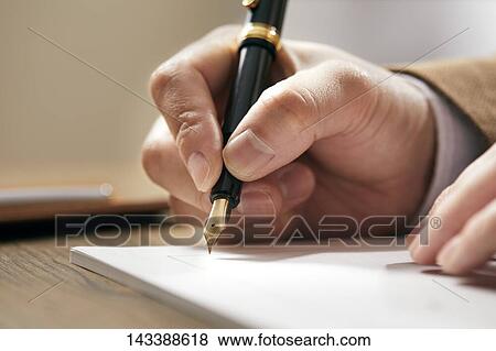 Man writing on paper View Large Photo Image Stock Photo - Man writing on paper. Fotosearch